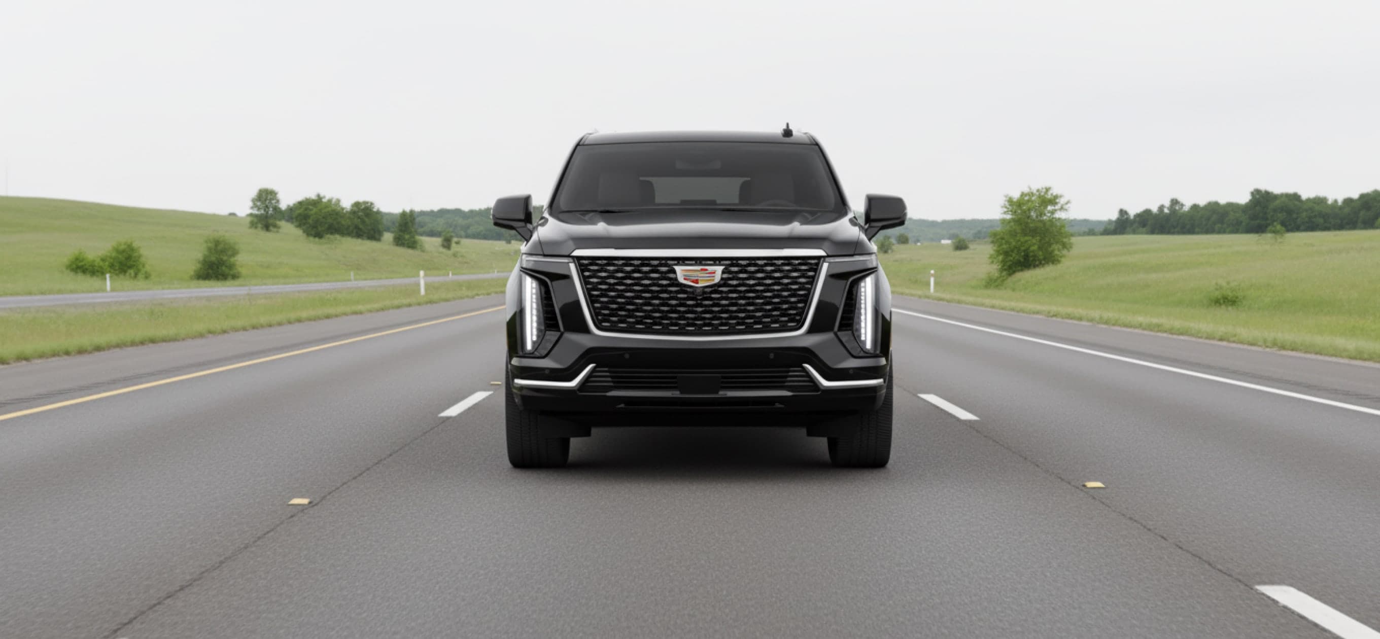 Black luxury SUV driving on an open highway